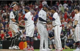  ?? JOHN MINCHILLO - ASSOCIATED PRESS ?? Members of the American League squad celebrate their 4-3 victory over the National League in the MLB baseball All-Star Game, Tuesday, July 9, 2019, in Cleveland. Not everything in the telecast was a hit.