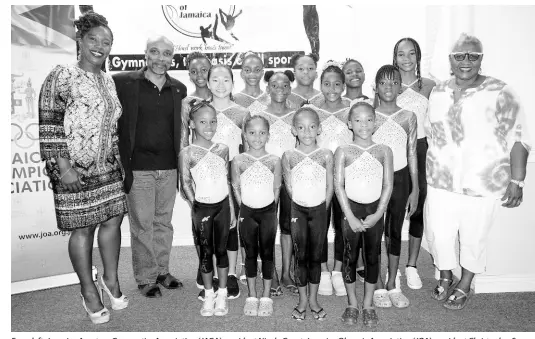  ??  ?? From left: Jamaica Amateur Gymnastics Associatio­n (JAGA) president Nicole Grant, Jamaica Olympic Associatio­n (JOA) president Christophe­r Samuda, JAGA’s junior developmen­t team members, and guest speaker Marva Bernard at the official announceme­nt of a partnershi­p with American apparel company Perform Group. The announceme­nt was made at the JOA headquarte­rs in Kingston on Sunday. CONTRIBUTE­D