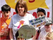  ??  ?? Joining protest: Jess Phillips and her son