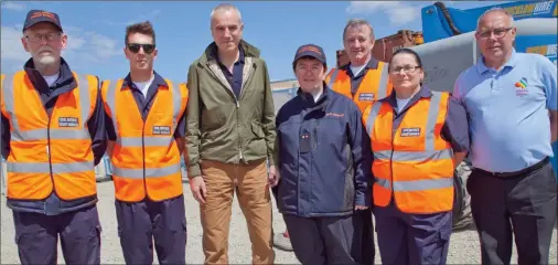  ??  ?? Sir Daniel Day-Lewis with the on-duty members of the Civil Defence.