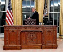  ?? AP ?? ‘‘Sir, that big old wooden desk we trucked down from Washington, we’re having trouble getting it into your en suite.’’