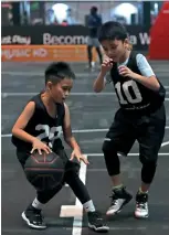  ?? Photos by Dhes Handumon ?? Children enjoy basketball and Ninja Warrior assault course as part of the summer camp at the Dubai World Trade Centre. The camp will continue till September 3. —