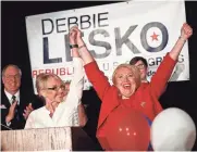  ?? MICHAEL CHOW/THE REPUBLIC ?? Former Gov. Jan Brewer (left) celebrates with Republican Rep.-elect Debbie Lesko on Tuesday at an election-night party in Peoria. Lesko defeated Democrat Hiral Tipirneni.