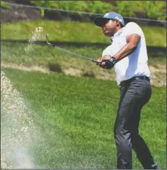  ?? The Associated Press ?? SAND NOT A PROBLEM: Sabastian Munoz hits from the trap on the ninth hole during the second round of The Greenbrier Classic Friday in White Sulphur Springs, W.Va. Munoz shot a 68 to retain a two-stroke lead going into the final round today.