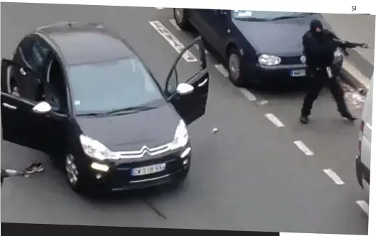  ??  ?? Barbaric: Gunmen attack the office of Charlie Hebdo in Paris this week