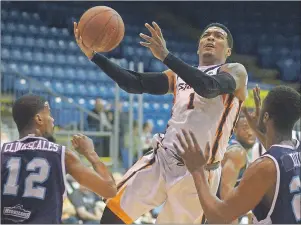  ?? JASON MALLOY/THE GUARDIAN ?? Island Storm point guard Jahii Carson drives to the paint Tuesday against the Halifax Hurricanes in Game 6 of the National Basketball League of Canada semifinal at the Eastlink Centre.