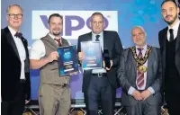  ??  ?? ●●The outstandin­g achievemen­t award was won by gardeners Jamie White and Mark Bourne presented by Nicholas Moore from YPO, the chief executive Steve Rumbelow and the mayor of Rochdale, Coun Mohammed Zaman