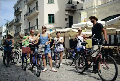 ?? PICTURE: REUTERS ?? A group of American tourists take a guided bicycle tour in Havana, Cuba, on Saturday.