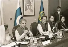  ?? AP ?? Pakistan’s Prime Minister Imran Khan (centre) attends a briefing at the foreign ministry in Islamabad, August 24