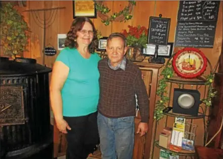  ?? PHOTO SPECIAL TO THE DISPATCH BY MIKE JAQUAYS ?? Foothill Hops Farm Brewery owners Kate, left, and Larry Fisher pose in their brand-new tasting room on Dec. 21in Munnsville.