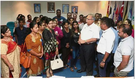  ??  ?? Anxious dependants: Ramasamy (third from right) talking to family members of those detained under Sosma after a press conference at Komtar in George Town, Penang.