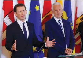  ?? (Leonhard Foeger/Reuters) ?? AUSTRIA’S CHANCELLOR Sebastian Kurz (left) and Justice Minister Josef Moser speak at a news conference in Vienna last month.