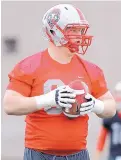  ?? JIM THOMPSON/JOURNAL ?? UNM offensive lineman Garrett Adcock is a second-year law student who is intent on making the world a better place.