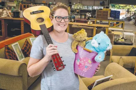  ?? Picture: JERAD WILLIAMS ?? Endeavour Foundation Recycling manager Alyssa Gordon with some of the goods saved for tip shops.