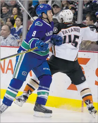  ?? GERRY KAHRMANN/PNG ?? Vancouver Canucks forward Brandon Prust, left, is out with a left-leg injury after colliding with Ryan Kesler Friday against Anaheim.