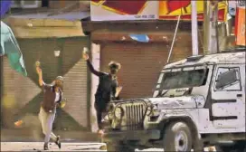  ?? AP FILE ?? Protesters throw rocks at a police vehicle in Srinagar on Friday.