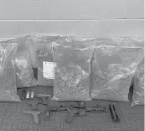  ?? COURTESY ?? Police said they seized 145 pounds of marijuana, 160 bags of fentanyl and four guns from a Hartford business during a recent drug raid.
