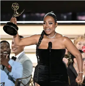  ?? ?? Ralph accepting the Emmy for best supporting actress in a comedy series on Sept. 12.