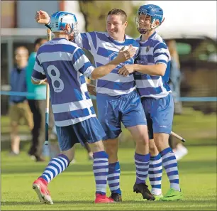  ?? Photo: Neil Paterson ?? Newtonmore’s Glen Mackintosh celebrates his second goal with David Fraser and Iain Robinson.