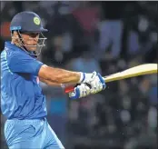  ??  ?? Mahendra Singh Dhoni plays a shot during the third ODI against Sri Lanka at the Pallekele Stadium on Sunday