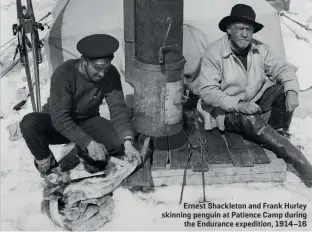  ??  ?? Ernest Shackleton and Frank Hurley skinning penguin at Patience Camp during the Endurance expedition, 1914–16