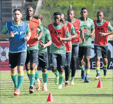  ?? Picture: GALLO IMAGES ?? HARD YARDS: Dean Furman in front of a line of Bafana Bafana players during a training session in Durban, ahead of their game today against Guinea-Bissau at the city’s Moses Mabhida Stadium