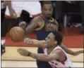  ?? FRED THORNHILL — THE CANADIAN PRESS VIA AP ?? The Raptors’ DeMar DeRozan is fouled by the Cavaliers’ J.R. Smith. Smith got in foul trouble in the third quarter.