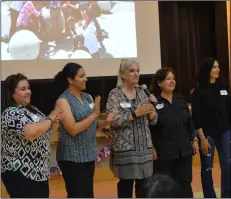  ??  ?? Gretchen Laue (center), director of UCSD’s Profession­al Developmen­t Institute, praises the work of the local high school counselors at her side for their effort. JULIo MorALes PhoTo