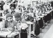  ?? A.M. AHAD/AP 2018 ?? Trainees work at their sewing machines at the Snowtex garment factory near Dhaka, Bangladesh.