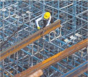  ?? Photo: Nampa/AFP ?? Workhorse… This photo shows an employee working at a constructi­on site in Ningbo, in China›s eastern Zhejiang province.