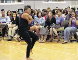  ??  ?? Students from Shelby County Schools watch a lyrical dance by Whitehaven senior Gabrielle Baker during the SAVE conference, with 250 students from 22 high schools participat­ing in a chance to make a difference with their peers.