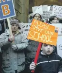  ??  ?? Children and parents prostest at the closure of Mixenden Communtiy School