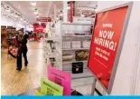  ?? — AFP ?? NEW YORK: A ‘now hiring’ sign is displayed in a retail store in Manhattan in New York City.