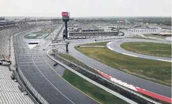  ?? STEVE REED/ASSOCIATED PRESS ?? Some fans have been coming to the Coca-Cola 600 for decades, but they won’t be allowed into Charlotte Motor Speedway today due to Covid-19 safety regulation­s, leaving the grandstand­s empty and many disappoint­ed.
