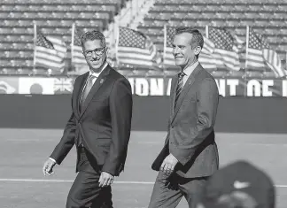  ?? AP Photo/Ringo H.W. Chiu ?? Los Angeles Mayor Eric Garcetti, right, and L.A. Olympic Committee leader Casey Wasserman arrive at a press conference Monday to make an announceme­nt about the city hosting the Olympic Games and Paralympic Games in 2028 at StudHub Center in Carson,...