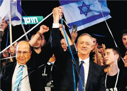  ?? JACK GUEZ / AFP / GETTY IMAGES FILES ?? Former Israeli chief of staff Benny Gantz, right, and his electoral ally, former defence minister Moshe Ya’alon, at a rally last month. Gantz’s slogan, “Israel before all else,” says it all about his emotional campaign tactics.
