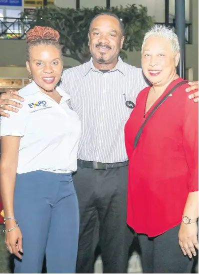  ?? ANGUIN PHOTOS ASHLEY ?? From left: Third Vice-President of the Montego Bay Chamber of Commerce and Industry and chairman of MoBay Expo, Damia Dawes-Monthrope shares lens time with Immediate past president of the Chamber, Winston Lawson, and first Vice-Presiden, Gabrielle Lee at the pre Expo cocktail party at Whitter Village recently.