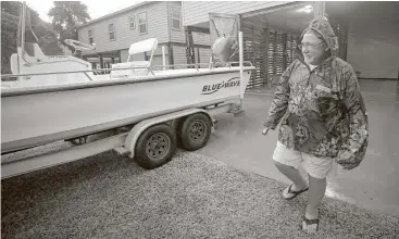  ?? Godofredo A. Vasquez / Houston Chronicle ?? David Price drove down from Lake Conroe on Thursday to retrieve his power fishing boat and other belongings from his weekend home in Matagorda before Hurricane Harvey made landfall Friday.