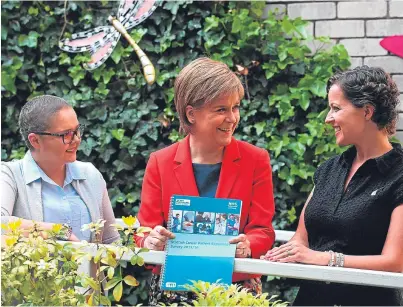  ?? Picture: PA. ?? First Minister Nicola Sturgeon with cancer patients Laura Fitzsimmon­s, 29, left, from Cardonald, and Susan Selkirk, 40, from Newton Mearns, during a visit to the Macmillan Cancer Support Centre at the Western General Hospital in Edinburgh.