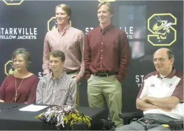  ?? Smith, SDN) (Photo by Danny P. ?? Starkville High School distance runner Slater Richardson, seated middle, celebrated his signing with Mississipp­i State on Thursday as family, friends, coaches and administra­tion supported his decision.
