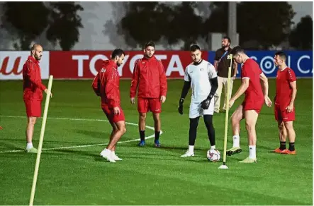  ?? — AFP ?? Calm before the storm: Palestine players at a training session in Sharjah, Dubai, on Friday.