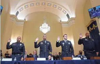  ?? POOL PHOTO BY ANDREW HARNIK ?? From left, Aquilino Gonell, Michael Fanone, Daniel Hodges and Harry Dunn, police who fought to defend the Capitol on Jan. 6, are sworn in Tuesday.
