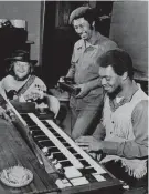  ?? BARNEY SELLERS/THE COMMERCIAL APPEAL ?? Three members of Booker T. and the MG’S, from left, Duck Dunn, Al Jackson and Booker T. Jones are shown at Stax in a photograph dated Jan. 21, 1970.