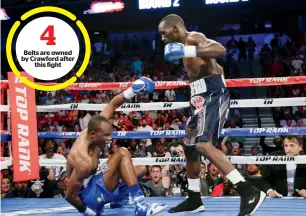  ?? AP ?? Belts are owned by Crawford after this fight Terence Crawford stands over Julius Indongo, after knocking him down in the second round of a junior welterweig­ht world title unificatio­n bout. —