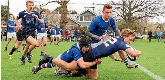  ?? PHOTO: JOSEPH JOHNSON ?? Ben Chippendal­e (CBHS) scores during the South Island secondary schoolboys final against Southland BHS at Straven Rd on Saturday.