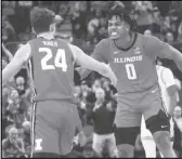  ?? Associated Press ?? Illinois guard Terrence Shannon Jr. (0) celebrates with forward Matthew Mayer (24) during the second half against UCLA on Friday in Las Vegas.