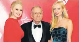  ?? AFP FILE ?? Hugh Hefner (centre) posing upon arrival for the 2012 MusiCares Person of the Year Tribute honouring Paul McCartney as Person of the Year in Los Angeles, California.