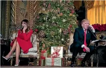  ?? PHOTO: AP ?? US President Donald Trump and First Lady Melania Trump speak on the phone with children as they track Santa Claus’s movements at the Mar-a-Lago estate in Palm Beach, Florida.