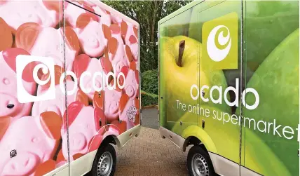  ?? Pic: Doug Peters/PA Wire ?? Afleet of Ocado delivery vans, as the online supermarke­t has seen sales rise by 10.6 per cent
