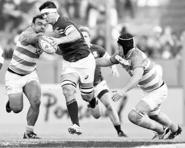  ??  ?? South Africa’s flanker Francois Louw (centre) runs through a tackle by Argentina’s Los Pumas hooker Agustin Creevy (left) and lock Matias Alemanno during their Rugby Championsh­ip match at Padre Ernesto Martearena stadium in Salta, Argentina in this Aug...